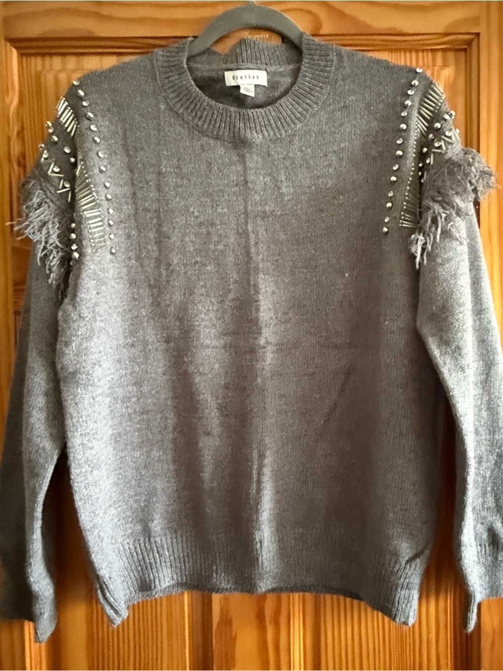 Stellah Gray Crewneck Sweater with Studs & Fringe Shoulder Detail